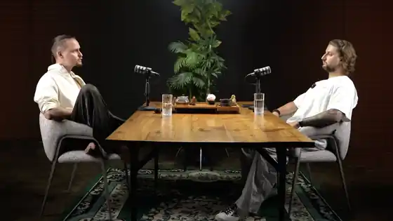 Podcast studio in Bali with two microphones and a camera set up for a video interview
