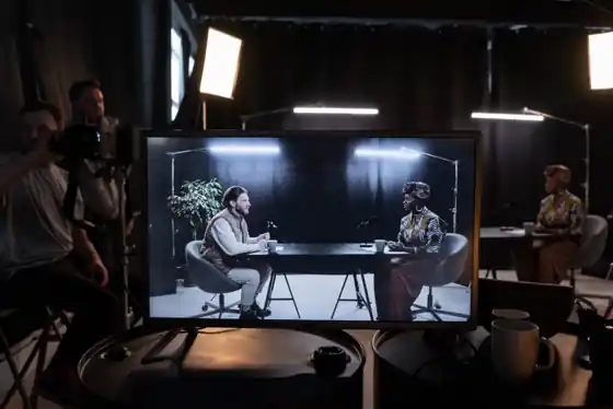 Host speaking to camera in a professional webinar studio with broadcast lighting